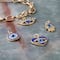 12 Packs: 4 ct. (48 total) Blue & Gold Evil Eye Charms by Bead Landing™
